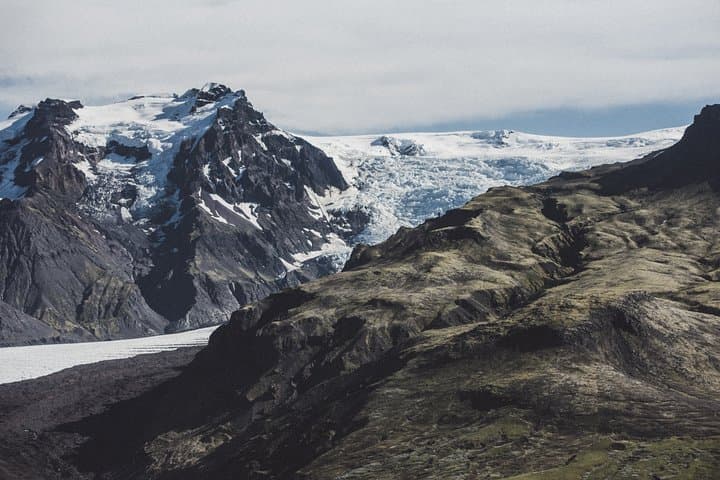 Airplane flight over glacier lagoons and Iceland's highest peak